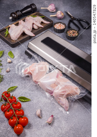 Raw chicken wings vacuum sealing for food preservation Raw chicken wings vacuum sealing for food preservation 140547829