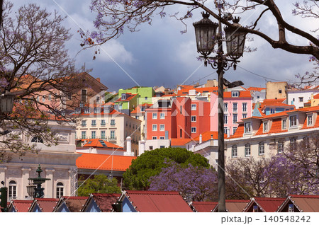 Colorful Residential Buildings and Jacaranda Trees in Lisbon Portugal Colorful Residential Buildings and Jacaranda Trees in Lisbon Portugal 140548242
