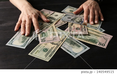 Female Hands holding Usa Dollar Bills Female Hands holding Usa Dollar Bills 140549515