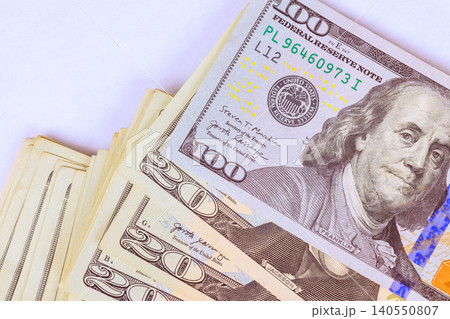 Different US dollar denominations of cash are placed on flat surface Different US dollar denominations of cash are placed on flat surface 140550807