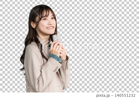 Young Asian businesswoman in urban office district holding smartphone Young Asian businesswoman in urban office district holding smartphone 140551232