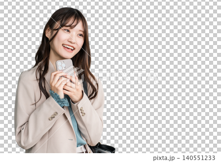 Young Asian businesswoman in urban office district holding smartphone Young Asian businesswoman in urban office district holding smartphone 140551233