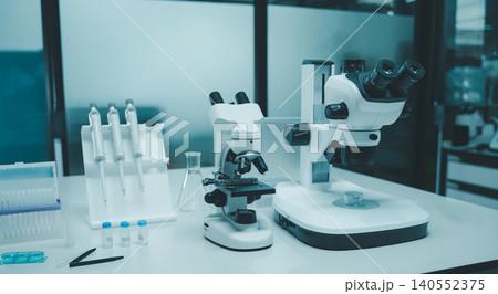 Advanced science laboratory equipment with microscopes and glassware for research 140552375