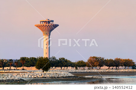 The iconic Al Khobar Water Tower stands tall against a pastel evening sky on the Persian Gulf coast in Saudi Arabia. The iconic Al Khobar Water Tower stands tall against a pastel evening sky on the Persian Gulf coast in Saudi Arabia. 140552412