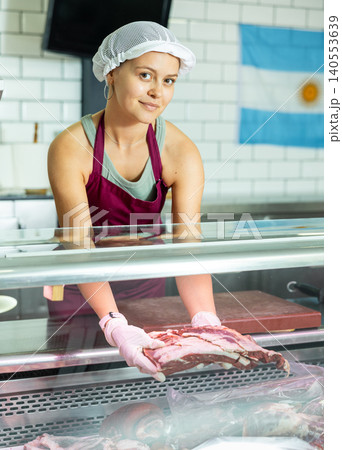 saleswoman expertly showcases selection 140553639