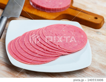 Appetizing boiled sausage mortadella from turkey on table Appetizing boiled sausage mortadella from turkey on table 140553806