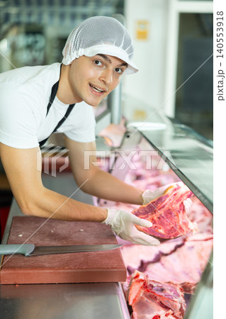 butcher skillfully working butcher skillfully working 140553918