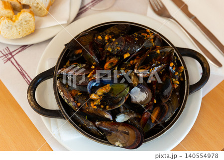 Grilled mussel dish with minced meat Grilled mussel dish with minced meat 140554978