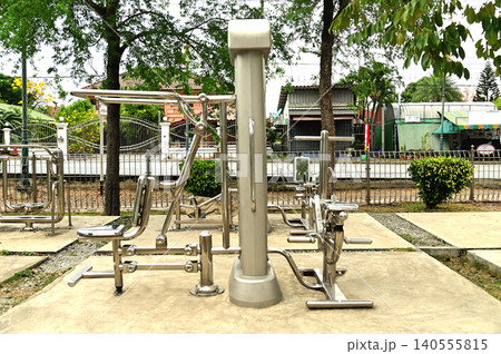 A variety of stainless steel exercise equipment is available for users to enjoy in Bang Sai Park, a local public park. A variety of stainless steel exercise equipment is available for users to enjoy in Bang Sai Park, a local public park. 140555815