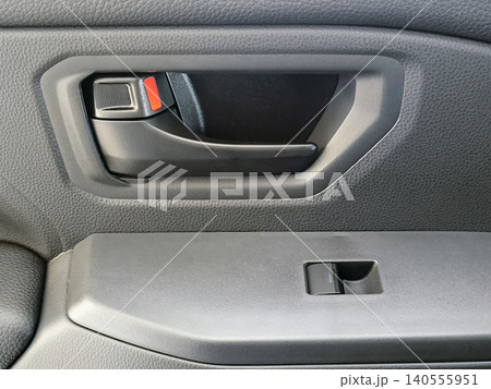 Car door panels, a modern car door interior showing lock switch, handle. Car door panels, a modern car door interior showing lock switch, handle. 140555951