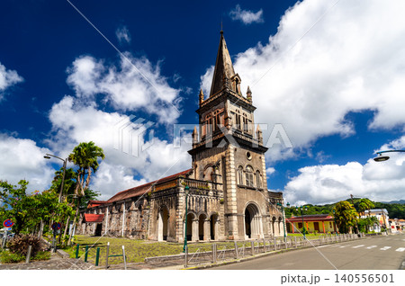 The historic Notre Dame de la Delivrande church stands under a bright blue sky in Le Morne Rouge, Martinique, Caribbean France 140556501