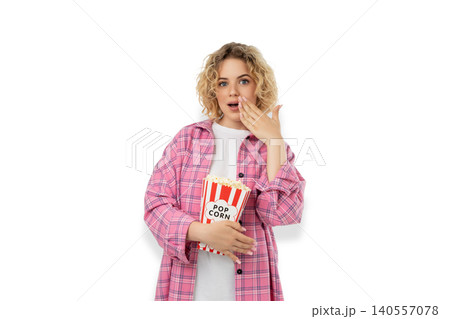 Surprised woman enjoys film with popcorn, PNG Surprised woman enjoys film with popcorn, PNG 140557078