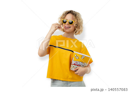 Woman holds popcorn and smiles in a casual outfit, PNG Woman holds popcorn and smiles in a casual outfit, PNG 140557083
