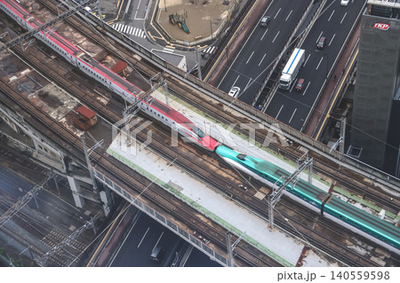 April 29 2026 Red bullet train passing through urban tracks April 29 2026 Red bullet train passing through urban tracks 140559598