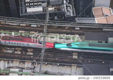 April 29 2026 Red bullet train passing through urban tracks 140559600