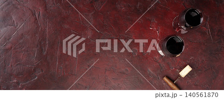Red Wine Glasses with Cork on Dark Rustic Background Red Wine Glasses with Cork on Dark Rustic Background 140561870