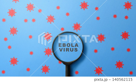 A conceptual image showing the words Ebola Virus viewed through a magnifying glass, surrounded by red virus icons on a blue background, representing medical research and disease investigation A conceptual image showing the words Ebola Virus viewed through a magnifying glass, surrounded by red virus icons on a blue background, representing medical research and disease investigation 140562115