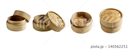 Collection of four small bamboo steamers shown from different angles and states, ideal for dim sum and traditional Asian cooking Collection of four small bamboo steamers shown from different angles and states, ideal for dim sum and traditional Asian cooking 140562251