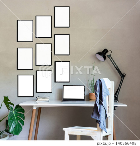 office home with laptop mockup and chair, document book on table decor white frame as lamp light and monstera tree pot plants house nature wall modern loft interior decorations workspace.Vertical 140566408