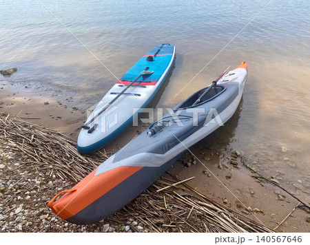 Two surfboards are laying on the beach 140567646