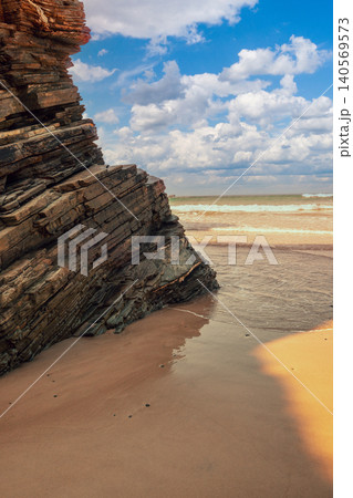 Beach Playa de Augas Santas (Beach of the Holy Waters, As Catedrais beach) during low tide at sunrise. Spain 140569573