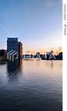 river in the city sunset river in the city sunset 140570387
