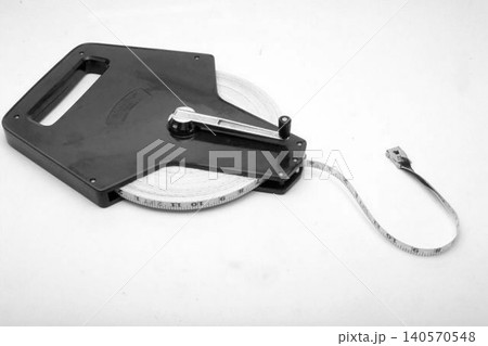 A realistic image of a Surveyor's Measuring Tape in Black Case 140570548