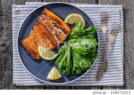 BBQ salmon fish on plate with fresh salad BBQ salmon fish on plate with fresh salad 140571633