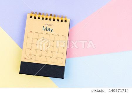 May 2027 desk calendar from brown paper on colorful background, Position with empty space. May 2027 desk calendar from brown paper on colorful background, Position with empty space. 140571714