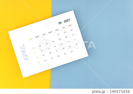 April 2027 calendar page on blue color background, Position with copy space. April 2027 calendar page on blue color background, Position with copy space. 140571838