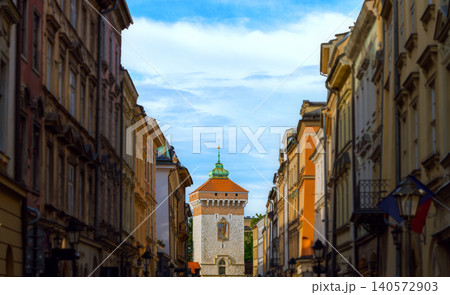 Charming historical street view featuring a watchtower and lined buildings Charming historical street view featuring a watchtower and lined buildings 140572903