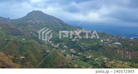 misty aerial panorama tropic country side landscape living log cabins and mountains in stormy time misty aerial panorama tropic country side landscape living log cabins and mountains in stormy time 140572905
