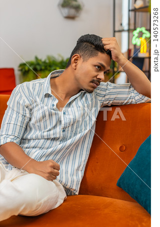 Indian man tired and bad mood after hard day stress fatigue burnout needs rest quiet time and calm Indian man tired and bad mood after hard day stress fatigue burnout needs rest quiet time and calm 140573268