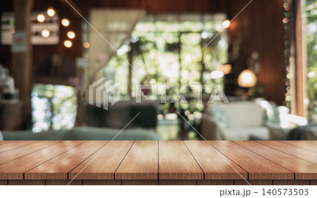 Empty wooden table top with lights bokeh on blur restaurant background. Empty wooden table top with lights bokeh on blur restaurant background. 140573503