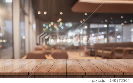 Empty wooden table top with lights bokeh on blur restaurant background.	 140573504