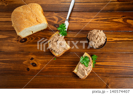 Rustic appetizer with liver pate and parsley garnish Rustic appetizer with liver pate and parsley garnish 140574407
