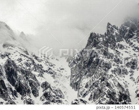 The jagged, snow-covered peaks. The jagged, snow-covered peaks. 140574551