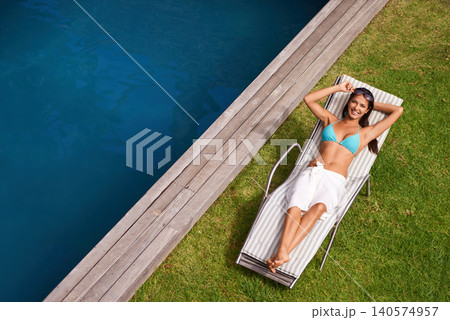 Portrait of woman, happy or tan at swimming pool to relax or chill in summer holiday vacation in Hawaii. Smile, break or calm female person sunbathing in swimwear at resort, home or hotel for peace 140574957