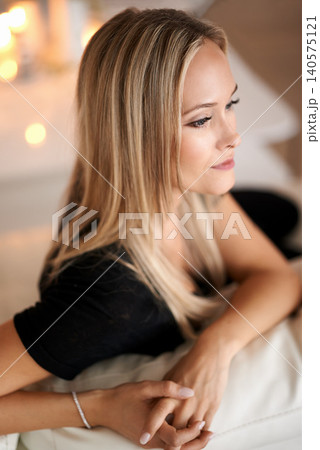 Night, woman and thinking on couch in living room, idea and wellness with candles in apartment. Thought, inspiration and blonde lady with rest on sofa, mindfulness and wax light on weekend in home Night, woman and thinking on couch in living room, idea and wellness with candles in apartment. Thought, inspiration and blonde lady with rest on sofa, mindfulness and wax light on weekend in home 140575121