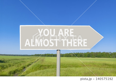 You are almost there symbol. Concept words You are almost there on beautiful grey road sign. Beautiful blue sky background. Business You are almost there motivational support concept. Copy space You are almost there symbol. Concept words You are almost there on beautiful grey road sign. Beautiful blue sky background. Business You are almost there motivational support concept. Copy space 140575192