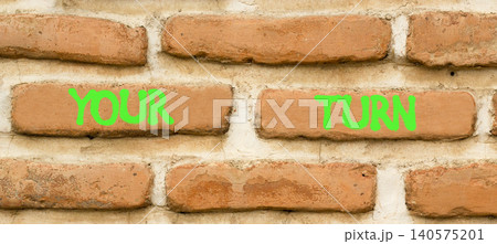 Your turn words symbol. Concept words Your turn on beautiful brick wall. Beautiful brick wall background. Business your turn motivational support concept. Copy space. Your turn words symbol. Concept words Your turn on beautiful brick wall. Beautiful brick wall background. Business your turn motivational support concept. Copy space. 140575201