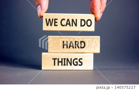 Support, help we can do hard things symbol. Concept words We can do hard things on beautiful wooden blocks. Beautiful grey background. Business we can do hard things concept. Copy space. Support, help we can do hard things symbol. Concept words We can do hard things on beautiful wooden blocks. Beautiful grey background. Business we can do hard things concept. Copy space. 140575217