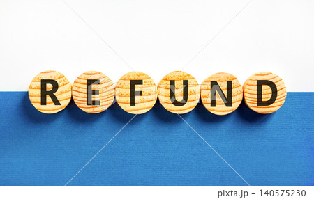 Refund word symbol. Concept word Refund on beautiful wooden circles. Beautiful blue and white background. Business word refund concept. Copy space. 140575230