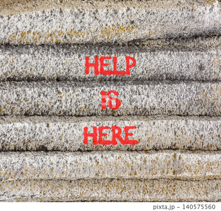Help is here and support words symbol. Concept words Help is here on beautiful grey stone. Beautiful grey stones background. Business help is here and support concept. Copy space. 140575560