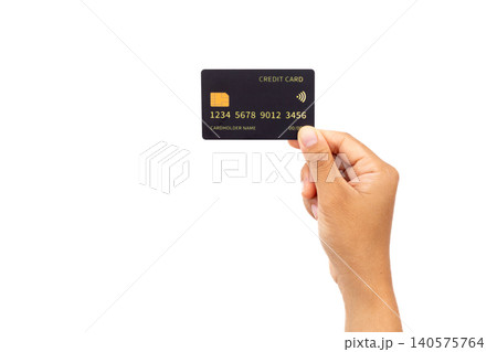 Hand holds credit card against plain white background. Simple composition draws focus to card details. Card shows generic numbers and chip symbol clearly. Hand presents card with gentle Hand holds credit card against plain white background. Simple composition draws focus to card details. Card shows generic numbers and chip symbol clearly. Hand presents card with gentle 140575764