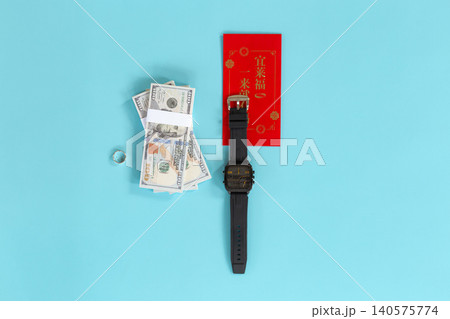 Bright blue background holds symbolic items. Red envelope suggests celebration or fortune. Stacked bills imply financial gain or reward. Black watch signals time's value or urgency Bright blue background holds symbolic items. Red envelope suggests celebration or fortune. Stacked bills imply financial gain or reward. Black watch signals time's value or urgency 140575774