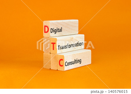 DTC digital transformation consulting symbol. Concept words DTC digital transformation consulting on beautiful wooden blocks. Beautiful orange background. Business DTC concept. Copy space. 140576015