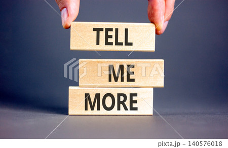 Tell me more words symbol. Concept words Tell me more on beautiful wooden blocks. Beautiful grey background. Businessman hand. Business and tell me more concept. Copy space. Tell me more words symbol. Concept words Tell me more on beautiful wooden blocks. Beautiful grey background. Businessman hand. Business and tell me more concept. Copy space. 140576018