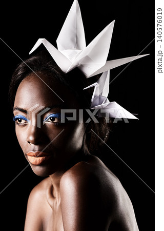 Studio, beauty and cosmetics for black woman with makeup in dark background with aesthetic for luxury. Eyeshadow, glow and foundation on face of girl for shine, African female person and origami 140576019