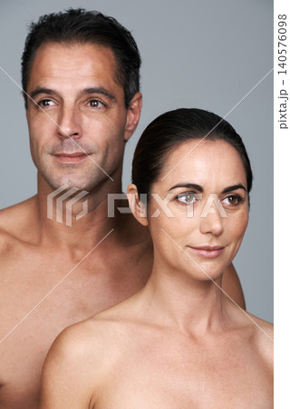 Couple, smile and skincare in studio, beauty and collagen cosmetics for anti aging. Mature people, facial treatment and dermatology for health on gray background, love and together for wellness Couple, smile and skincare in studio, beauty and collagen cosmetics for anti aging. Mature people, facial treatment and dermatology for health on gray background, love and together for wellness 140576098